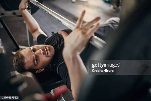 man doing bench press training - bench press stock pictures, royalty-free photos & images