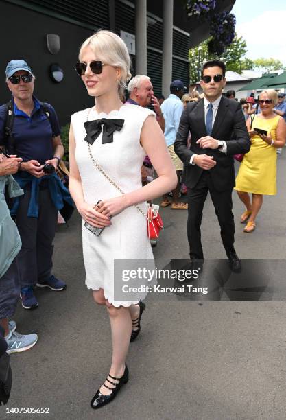 Lucy Boynton and Rami Malek attend day 12 of the Wimbledon Tennis Championships at the All England Lawn Tennis and Croquet Club on July 08, 2022 in...
