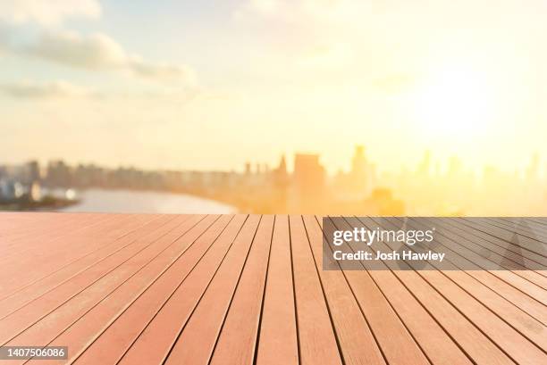 empty wooden platform with city background - platform shoe stock pictures, royalty-free photos & images