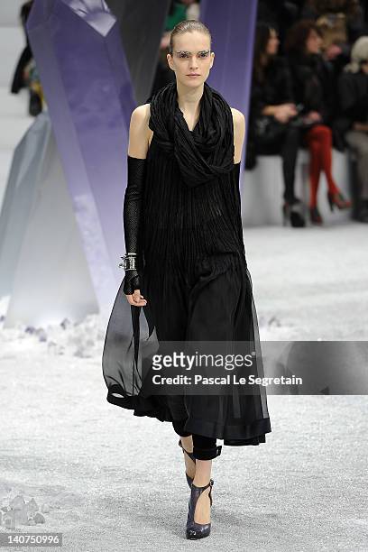 Model walks the runway during the Chanel Ready-To-Wear Fall/Winter 2012 show as part of Paris Fashion Week at Grand Palais on March 6, 2012 in Paris,...