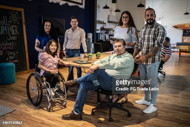portrait of team at office - disability awareness stock pictures, royalty-free photos & images