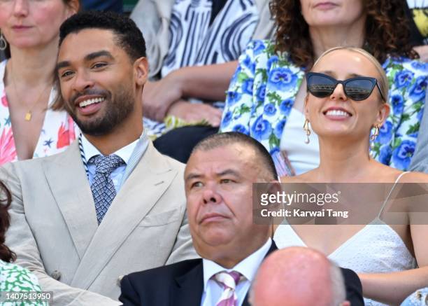 Regé-Jean Page, Emily Brown and Professor Sir Jonathan Van-Tam attend day 12 of the Wimbledon Tennis Championships at All England Lawn Tennis and...