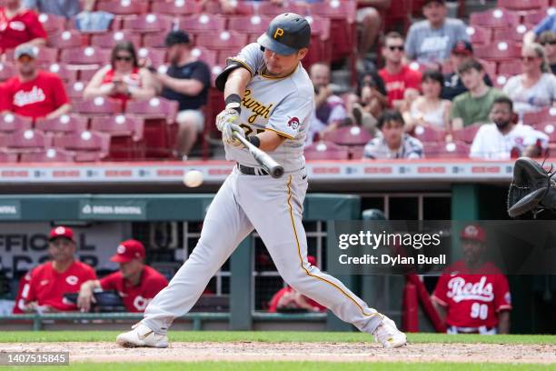 Yoshi Tsutsugo of the Pittsburgh Pirates hits a single in the eighth inning against the Cincinnati Reds during game one of a doubleheader at Great...