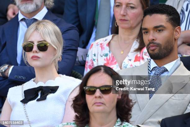 Lucy Boynton and Regé-Jean Page attend day 12 of the Wimbledon Tennis Championships at All England Lawn Tennis and Croquet Club on July 08, 2022 in...