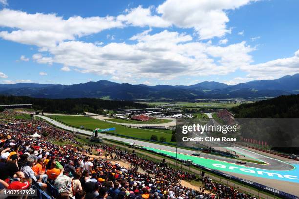 General view showing Sebastian Vettel of Germany driving the Aston Martin AMR22 Mercedes and Max Verstappen of the Netherlands driving the Oracle Red...