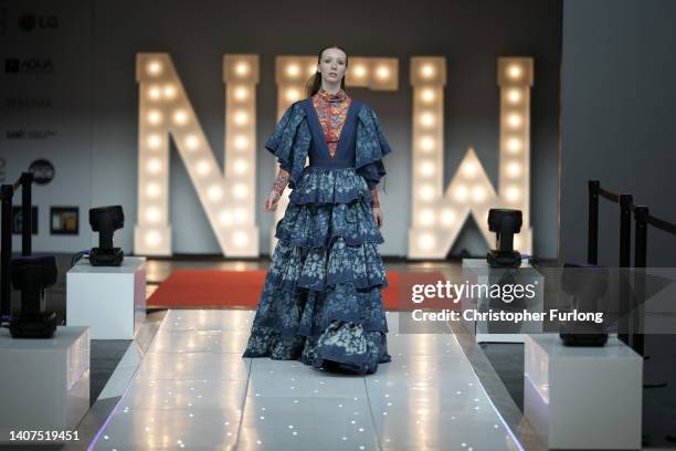 Model Patty Wijas poses wearing a dress made from recycled denim by designer Lilli Sipeki during the sustainability show at the inaugural Northern...