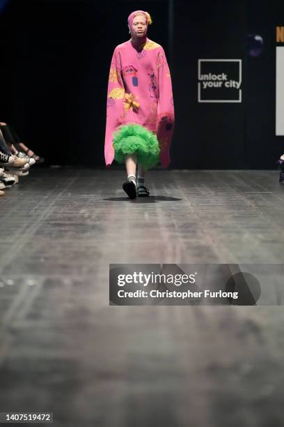 Model walks down the catwalk during the graduate show at the inaugural Northern Fashion Week at Manchester Central on July 08, 2022 in Manchester,...