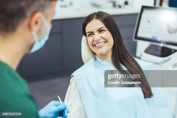 young woman patient having dental treatment at dentist's office - dental office bildbanksfoton och bilder