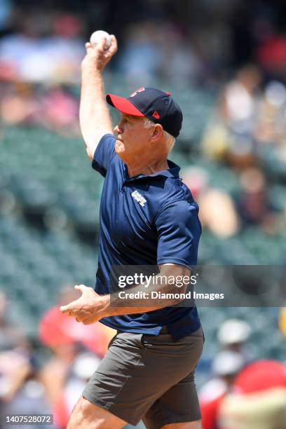 Executive Vice President of Football Operations Daryl Johnston throws the ceremonial first pitch prior to a game between the Minnesota Twins and the...