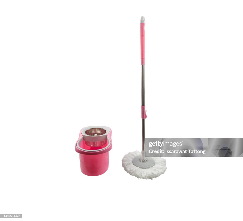 Pink spin mop with bucket on white background