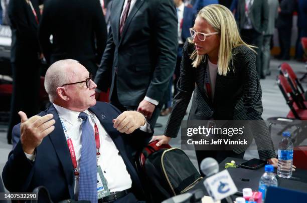 President of hockey operations Jim Rutherford and assistant general manager Emilie Castonguay of the Vancouver Canucks talk during the first round of...