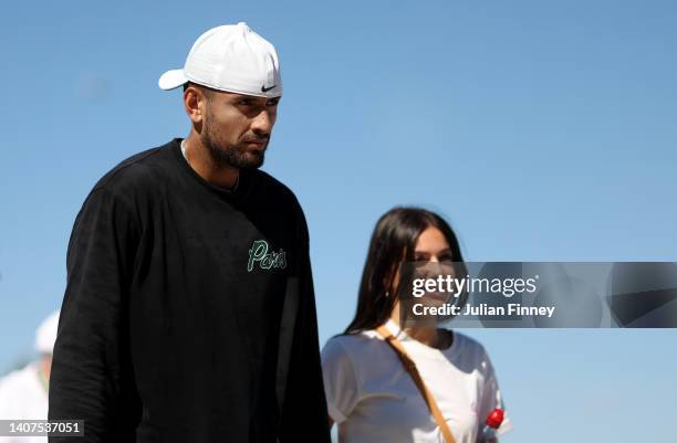 Nick Kyrgios of Australia is seen during a practice session with girlfriend Costeen Hatzi on day twelve of The Championships Wimbledon 2022 at All...