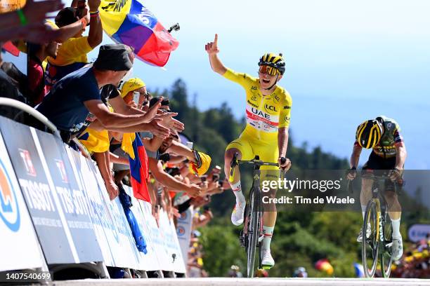 Tadej Pogacar of Slovenia and UAE Team Emirates - Yellow Leader Jersey celebrates at finish line as stage winner ahead of Jonas Vingegaard Rasmussen...