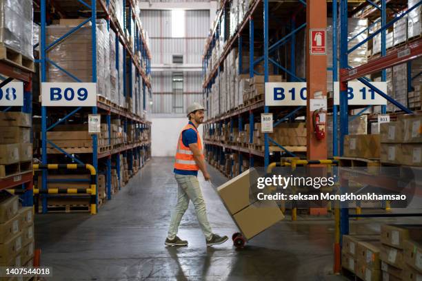 warehouse worker - helmet cart stock pictures, royalty-free photos & images