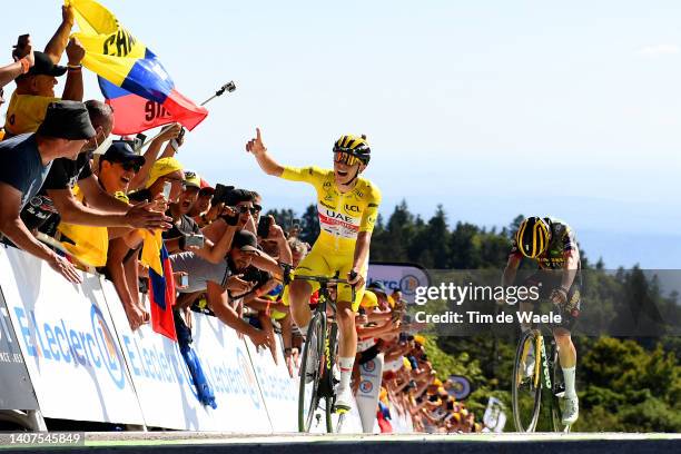 Tadej Pogacar of Slovenia and UAE Team Emirates - Yellow Leader Jersey celebrates at finish line as stage winner ahead of Jonas Vingegaard Rasmussen...