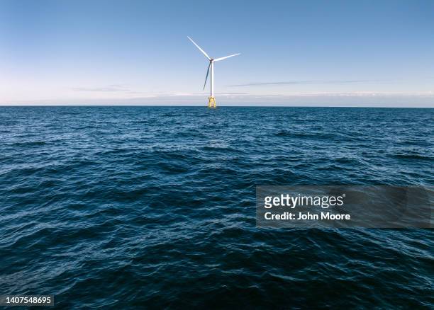 In an aerial view, wind turbines generate electricity at the Block Island Wind Farm on July 07, 2022 near Block Island, Rhode Island. The first...