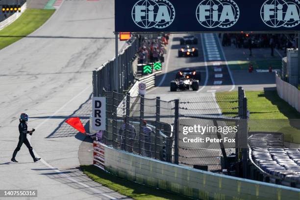George Russell of Mercedes and Great Britain walks back to the pits after crashing during practice/qualifying ahead of the F1 Grand Prix of Austria...