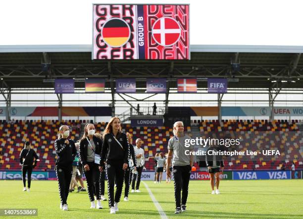 Karen Holmgaard and Pernille Harder of Denmark inspect the pitch prior to the UEFA Women's Euro 2022 group B match between Germany and Denmark at...