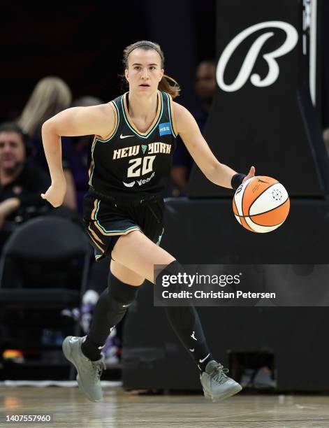 Sabrina Ionescu of the New York Liberty handles the ball during the WNBA game at Footprint Center on July 07, 2022 in Phoenix, Arizona. The Mercury...