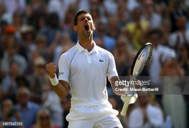 Novak Djokovic of Serbia celebrates match point against Cameron Norrie of Great Britain during the Mens' Singles Semi Final match on day twelve of...