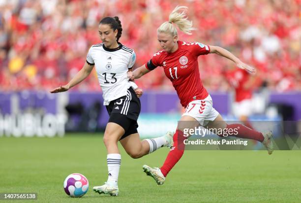 Sara Dabritz of Germany is challenged by Rikke Madsen of Denmark during the UEFA Women's Euro 2022 group B match between Germany and Denmark at...
