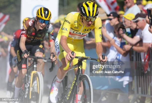 Race leader's yellow jersey Tadej Pogacar of Slovenia and UAE Team Emirates, left Jonas Vingegaard Rasmussen of Denmark and Team Jumbo - Visma during...