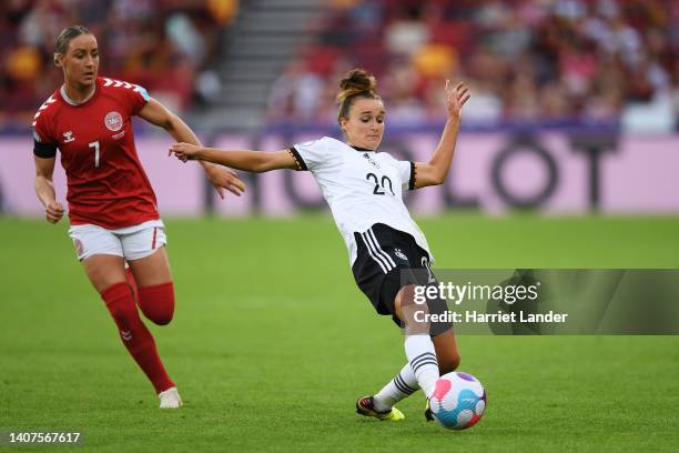 Lina Magull of Germany is challenged by Sanne Troelsgaard of Denmark during the UEFA Women's Euro 2022 group B match between Germany and Denmark at...