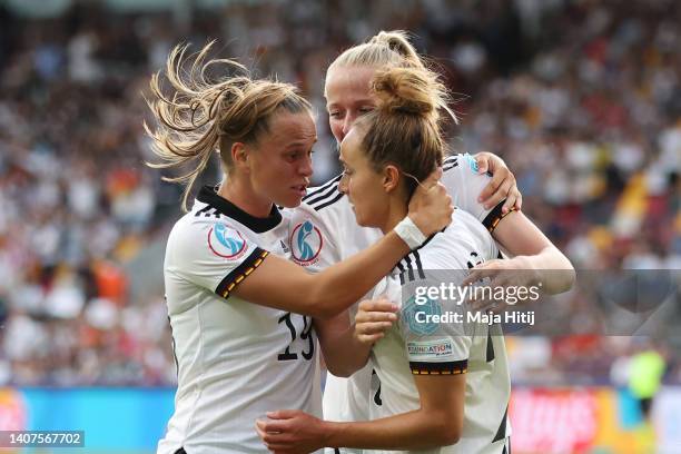 Lina Magull of Germany celebrates their team's first goal with teammates Klara Buehl and Lea Schueller during the UEFA Women's Euro England 2022...