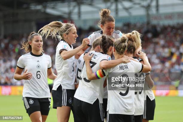 Lina Magull of Germany celebrates their team's first goal with teammates during the UEFA Women's Euro England 2022 group B match between Germany and...