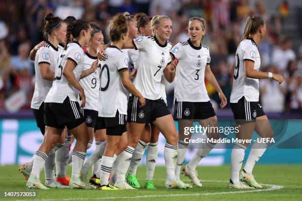 Lea Schuller of Germany celebrates with teammates after scoring their team's second goal during the UEFA Women's Euro 2022 group B match between...