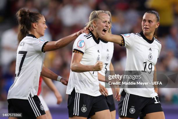 Lea Schuller celebrates with teammates Felicitas Rauch and Klara Buhl of Germany after scoring their team's second goal during the UEFA Women's Euro...