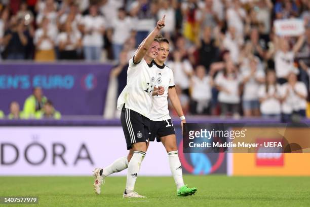 Alexandra Popp celebrates with Felicitas Rauch of Germany after scoring their team's fourth goal during the UEFA Women's Euro 2022 group B match...