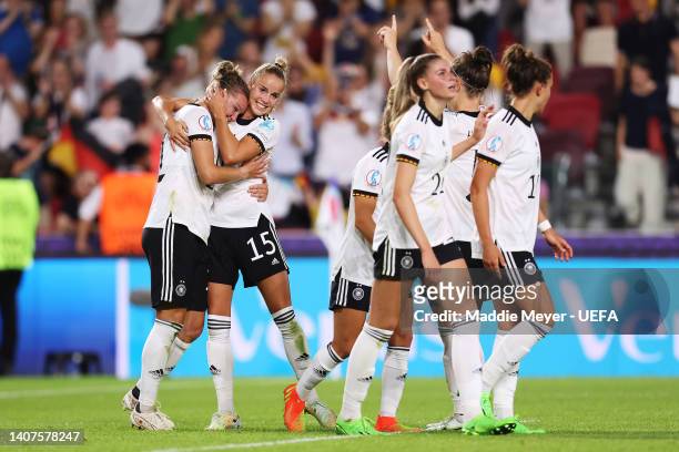 Alexandra Popp celebrates with Giulia Gwinn of Germany after scoring their team's fourth goal during the UEFA Women's Euro 2022 group B match between...
