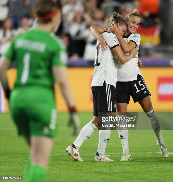 Alexandra Popp of Germany celebrates their team's fourth goal with teammate Giulia Gwinn during the UEFA Women's Euro England 2022 group B match...