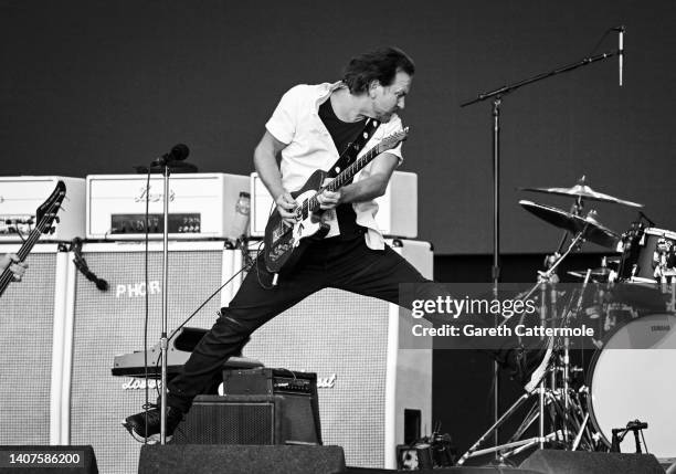 Eddie Vedder of Pearl Jam jumps while performing on stage as American Express Presents BST Hyde Park, in Hyde Park on July 08, 2022 in London,...