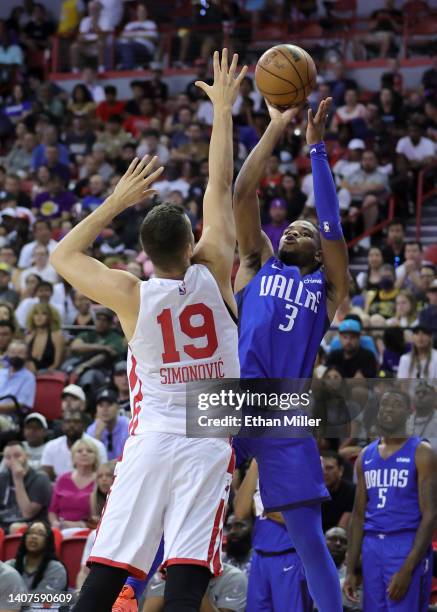 Jaden Hardy of the Dallas Mavericks shoots against Marko Simonovic of the Chicago Bulls during the 2022 NBA Summer League at the Thomas & Mack Center...