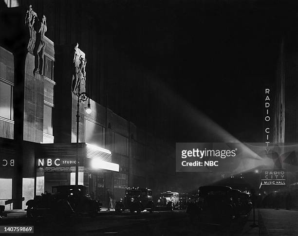 Pictured: The entrance to NBC Studios Radio City at Rockefeller Center and across the street, Radio City Music Hall in 1932-1933 shortly after the...