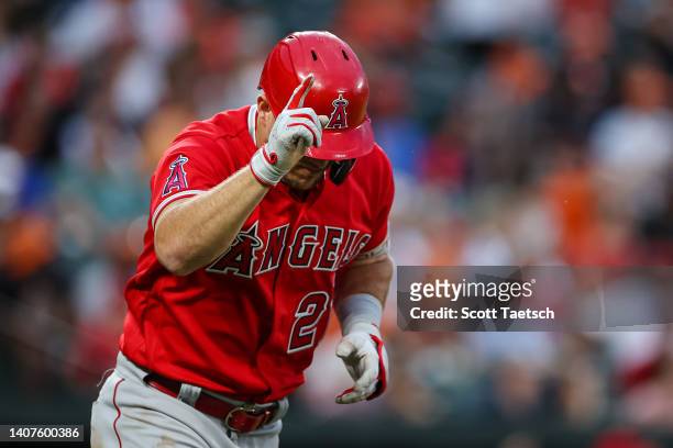 Mike Trout of the Los Angeles Angels points as he rounds the bases after hitting a three run home run against the Baltimore Orioles during the third...
