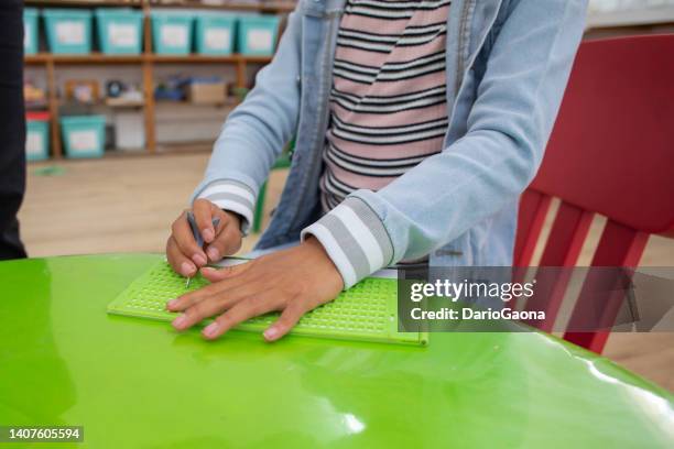 blind girl learning to write braille - assistive technology student stock pictures, royalty-free photos & images
