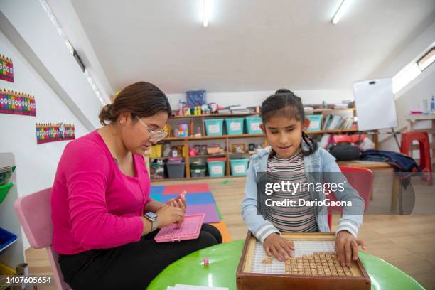 teacher teaching math to blind girl - assistive technology student stock pictures, royalty-free photos & images