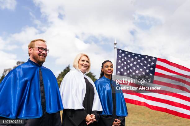 teachers at graduation ceremony - dean stock pictures, royalty-free photos & images