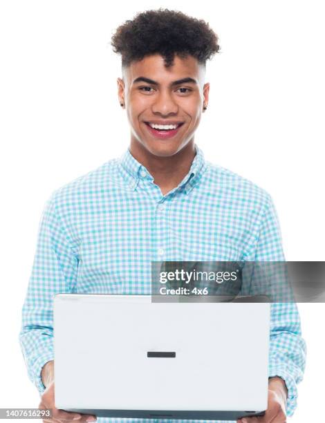 african-american ethnicity male standing in front of white background wearing sports shoe and using computer - roll shirt stock pictures, royalty-free photos & images