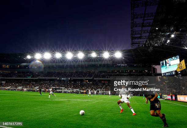 Carlos Vela of Los Angeles FC controls the ball against Raheem Edwards of Los Angeles Galaxy in the second half at Banc of California Stadium on July...