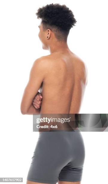 african ethnicity male standing in front of white background wearing men's underpants - boys bare bum stock pictures, royalty-free photos & images