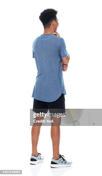 african ethnicity teenage boys standing in front of white background wearing t-shirt - man tshirt full body stock pictures, royalty-free photos & images
