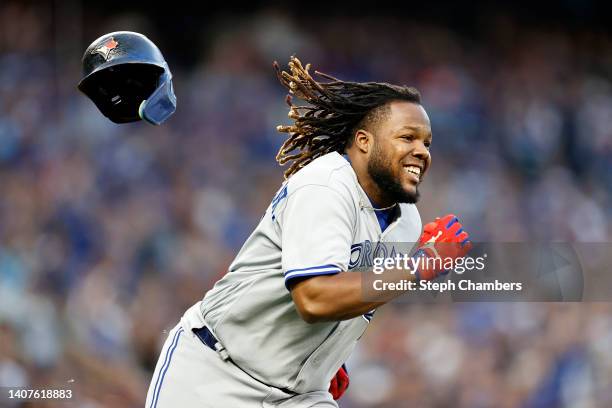 Vladimir Guerrero Jr. #27 of the Toronto Blue Jays loses his helmet as he runs to first base during the fifth inning against the Seattle Mariners at...