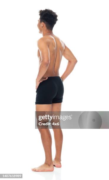 generation z teenage boys standing in front of white background wearing underwear - boys bare bum stock pictures, royalty-free photos & images