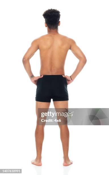 african ethnicity male standing in front of white background wearing men's underpants - boys bare bum 個照片及圖片檔