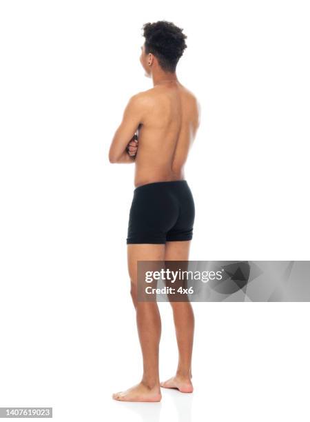 african ethnicity male standing in front of white background wearing men's underpants - boys bare bum 個照片及圖片檔