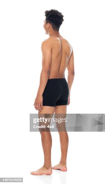 african-american ethnicity young male standing in front of white background wearing boxer shorts - boys bare bum stock pictures, royalty-free photos & images